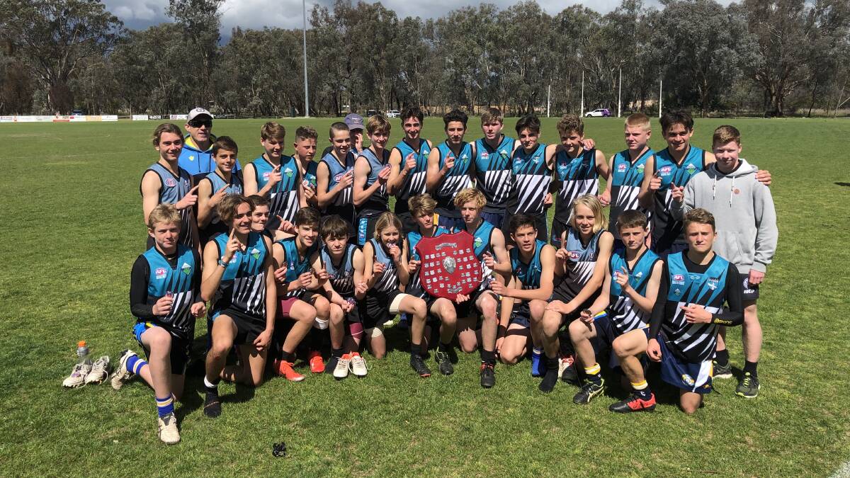 State champions: The Kiama High School students with the Swans Shield. Picture: Tim Martin.