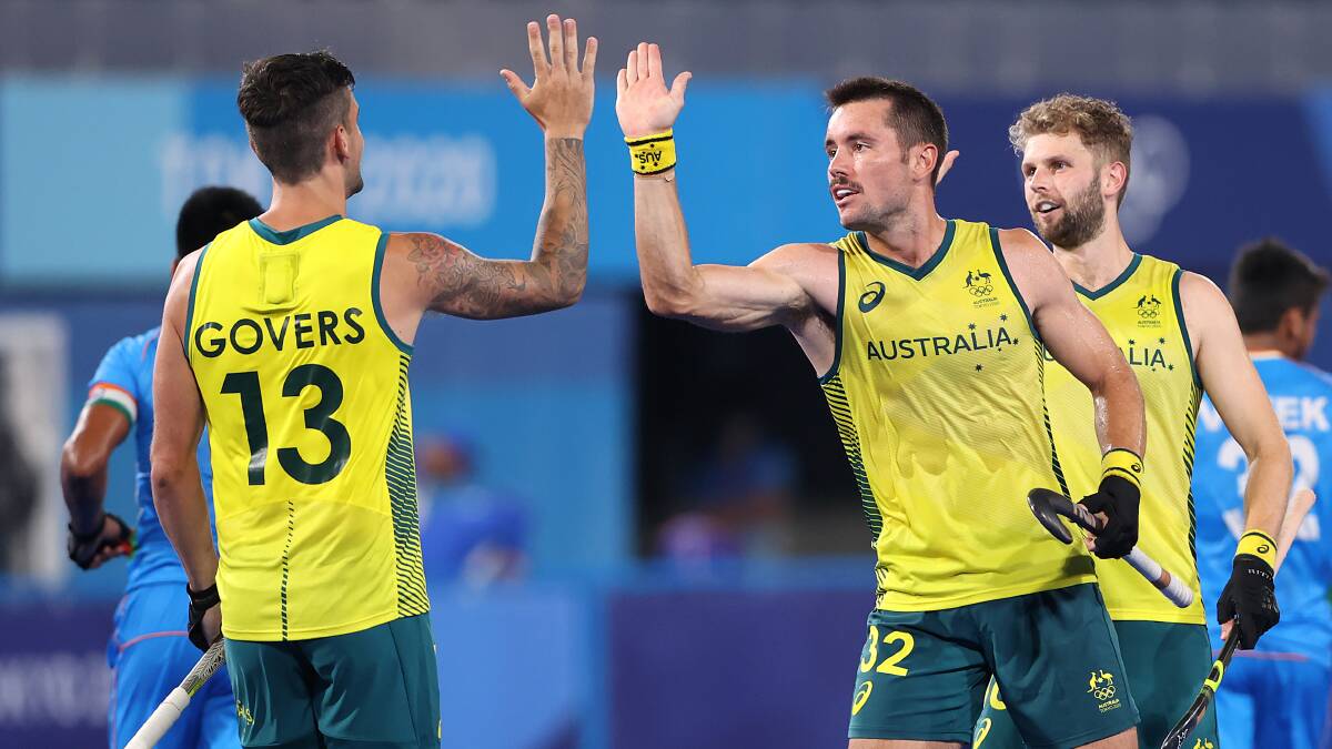 Victory: Blake Govers celebrates a goal with Jeremy Thomas Hayward in Australia's win over India. Picture: Alexander Hassenstein/Getty Images