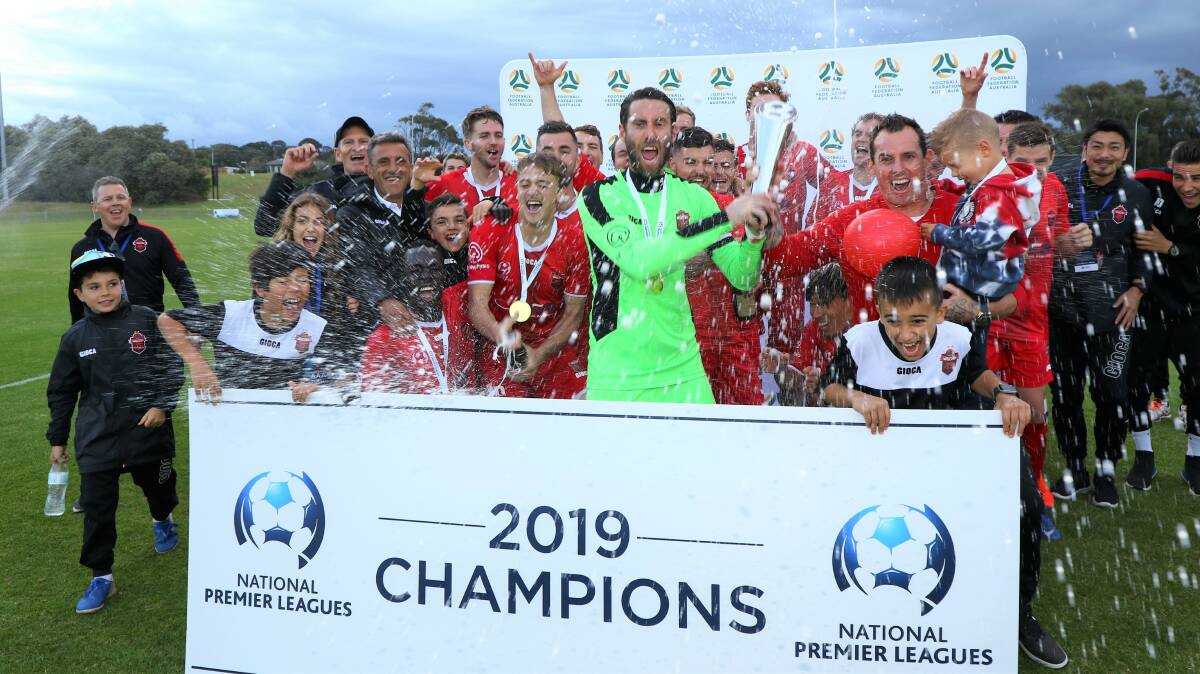 National Champions: The Wollongong Wolves celebrate Saturday's victory. Picture: Pedro Garcia.