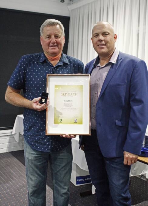 Recognition: Greg Harris (left) with Cricket NSW area manager Paul Brockley. Picture: Supplied.