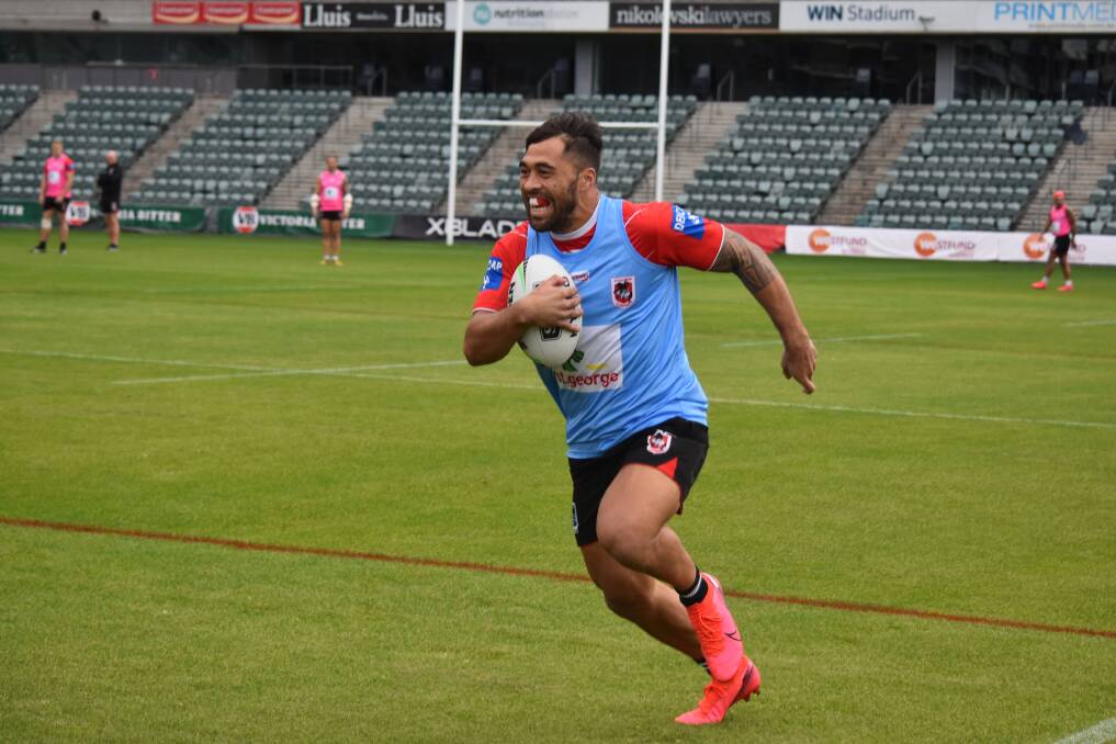 On the charge: Dragons winger Jordan Pereira takes off at training.