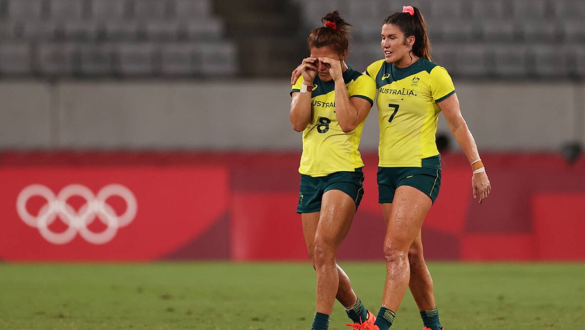 Heartbreak: Madison Ashby (L) and Charlotte Caslick (R) react after Australia's quarter-final defeat on Friday night. Picture: Dan Mullan/Getty Images