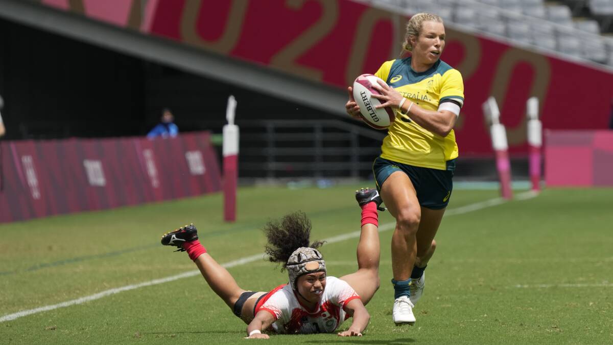 In the clear: Emma Tonegato starred for Australia during the opening day of the women's rugby sevens competition. Picture: Shuji Kajiyama/AP