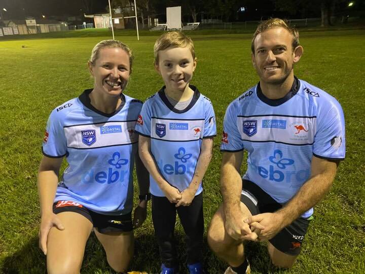 Important cause: Jamberoo's Aimee Barnard (left) and Jono Dallas (right) with EB sufferer Kye North in the jerseys they will wear to raise awareness for DEBRA Australia.