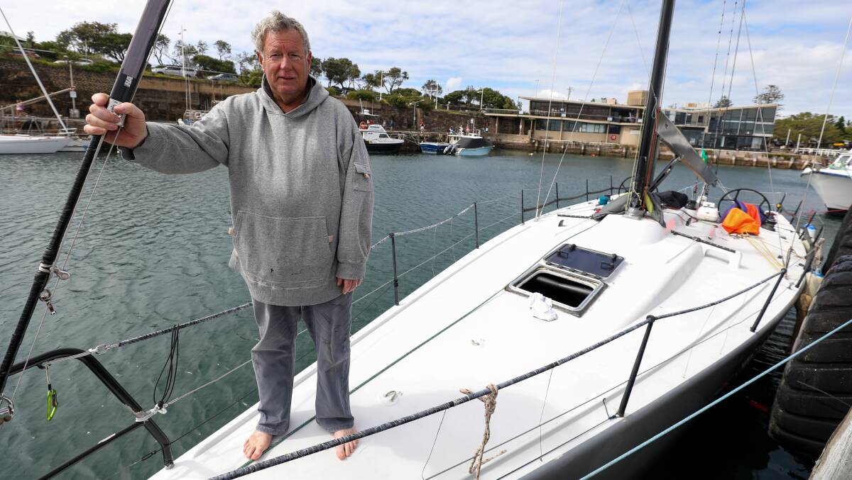 Tough times: Skipper Damien Parkes with his boat Denali in Wollongong harbour after it was forced to withdraw from the Sydney to Hobart. Picture: Adam McLean