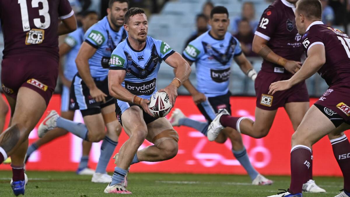 Close call: Damien Cook sizes up the Queensland defence during Origin II, a game he almost missed. Picture: Grant Trouville/NRL Imagery.