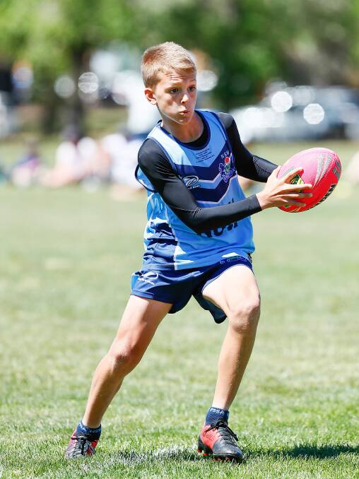 Evasive: Thirroul yougnster Noah Fien in action at the Australian Primary School Touch Football Championships. Picture: Belinda O'Rourke.