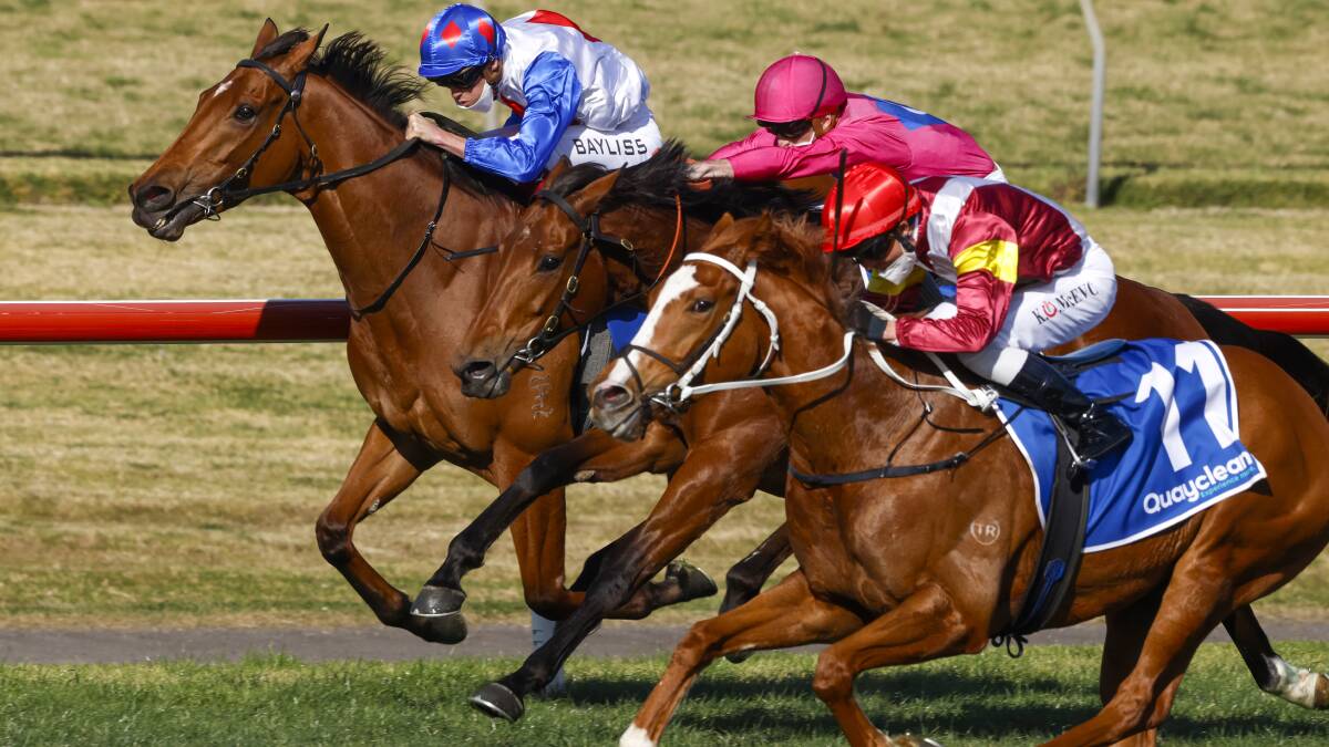 Race to the line: Josh Parr (pink silks) and Gemmahra finish second behind Crystal Pegasus (outside) at Kembla Grange on Saturday. Picture: Mark Evans/Getty Images
