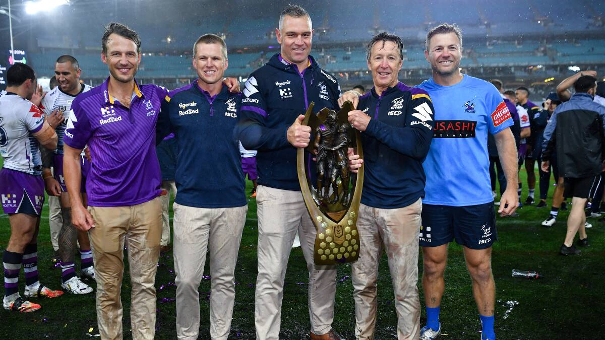 Winners: Jason Ryles (third from left) and Craig Bellamy. Picture: NRL Imagery.