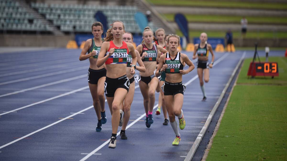 Out in front: Tayissa Buchanan (left) competing at the NSW Junior Championships. Picture: Athletics NSW. 