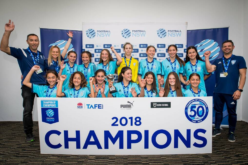Victorious: The Shellharbour 14 girls completed a successful season with the Champion of Champions trophy. Picture: Football NSW/Loopii. 