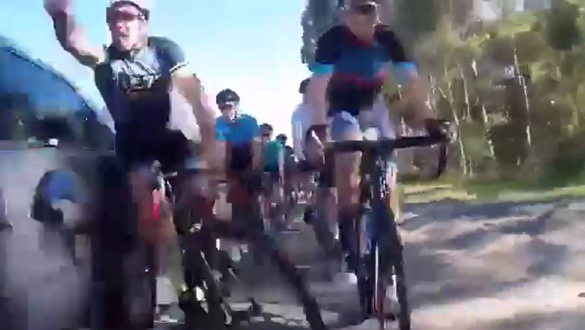 A screenshot of the video which shows a group of cyclists being struck by a car on the Newcastle Inner City Bypass.