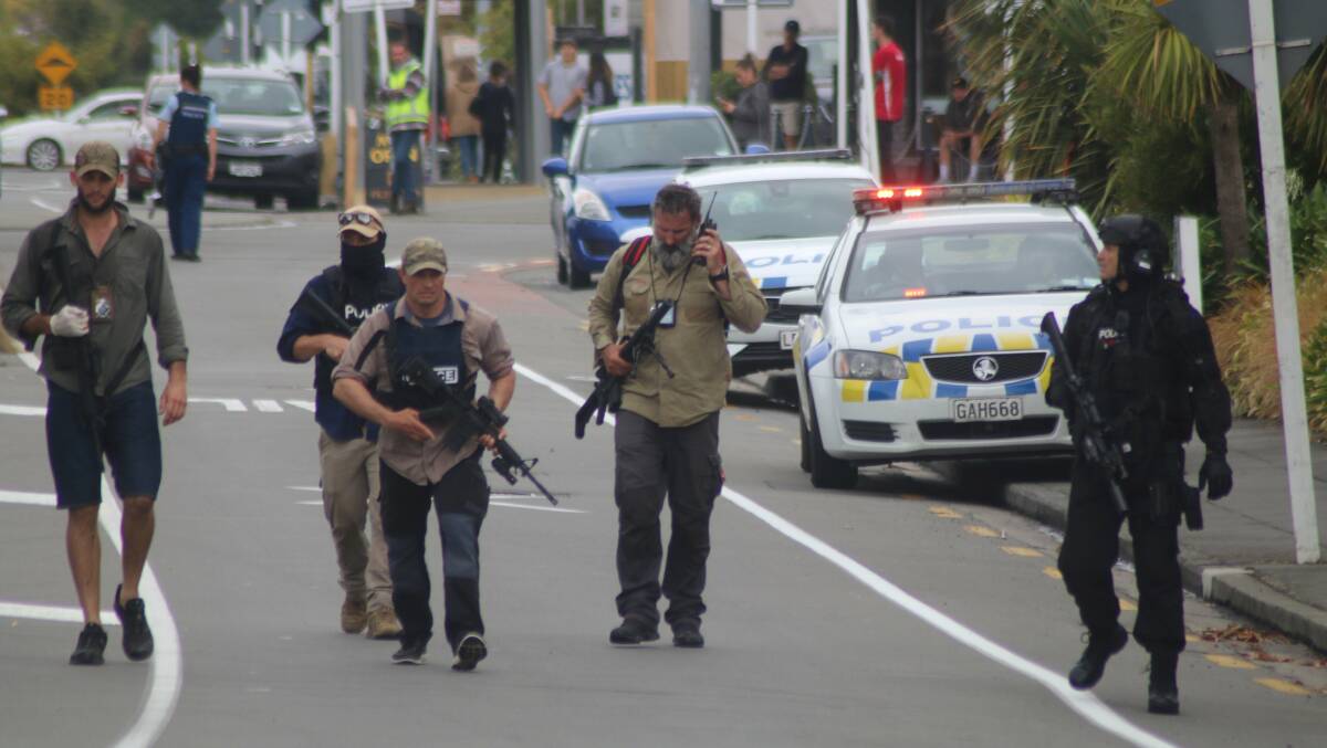 RESPONSE: Armed police on Langdons Road, Papanui, following the shootings in Christchurch on Friday.