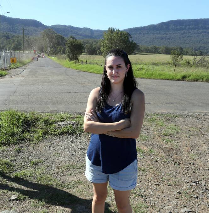 Growing dissent: Ami Beck, pictured at the junction where the proposed prison land meets her future housing estate, says jail opponents have already gathered thousands of signatures. 