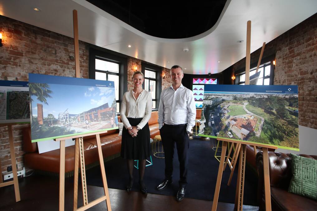 Still 700 apartments: Corrimal cokeworks developers Kate Strahorn, from Illawarra Coke Company, and Mike Williams from Legacy Property with artist's impressions of their latest plans. Picture: Sylvia Liber.
