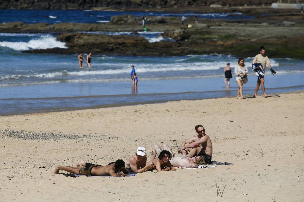 Beach season: The weekend's warm weather attracted residents and visitors to Wollongong's beaches, which will officially open for the summer season at the end of next month. Pictures: Anna Warr.