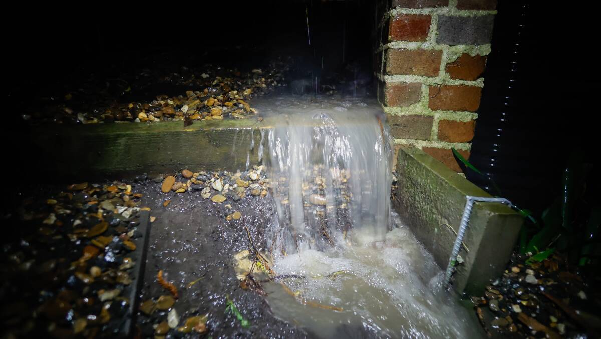 A drain overflows. Picture Anna Warr