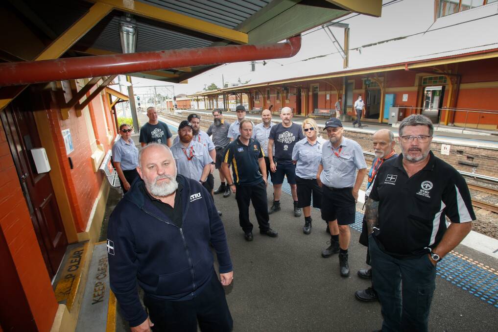 Blame game: "Everyone has been coming in ready to work, every depot across NSW is full of drivers and guards ready to work," local union councillor Paul Dornan, front left, said on Monday. Picture: Anna Warr.