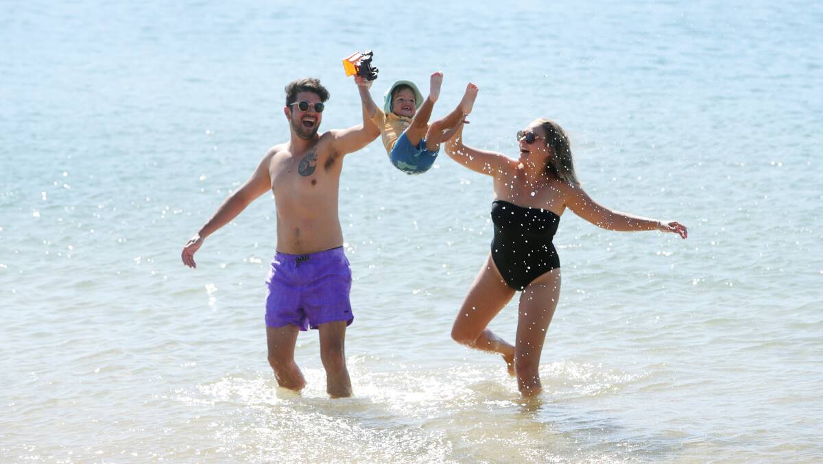 Chris and Lauren Malliate enjoyed a splash at Belmore Basin with two-year-old Elijah as the temperature topped 30. Picture by Sylvia Liber