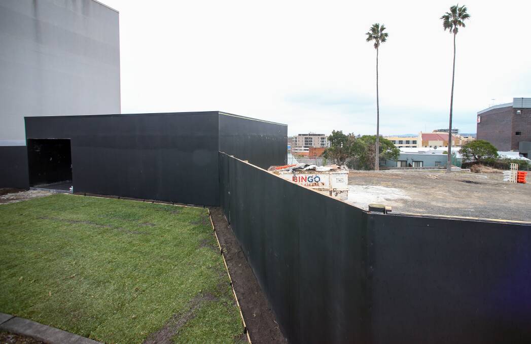 Sales office in the making: Black cladding was installed at 3 Rawson Street this week.