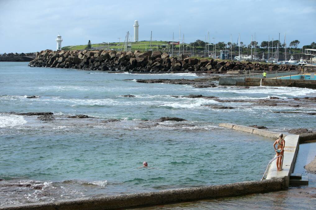 A safe distance: Wollongong's supervised pools are closed, but - as long as people remain apart - the rock pools along the coast remain open. Picture: Sylvia Liber. 