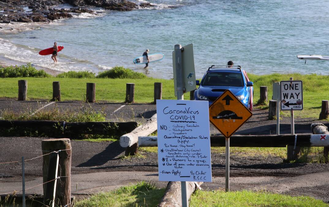 'No Sydneysiders': The issue of out-of-towners using beaches has also cropped up in Shellharbour; here a homemade sign at The Farm lists beach "rules". Picture: Sylvia Liber.