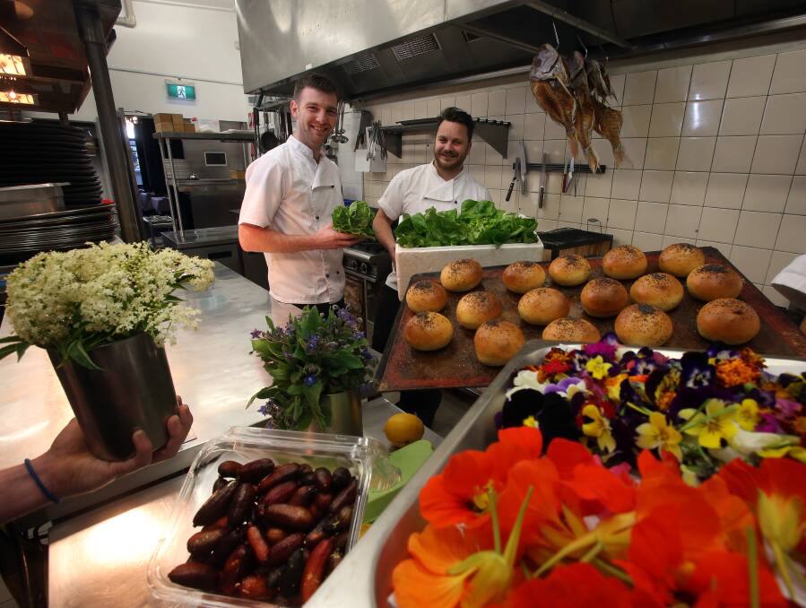 Caveau owners Tom Chiumento and Simon Evans with some of the Illawarra produce they've been using in the restaurant this winter. Picture: Robert Peet.