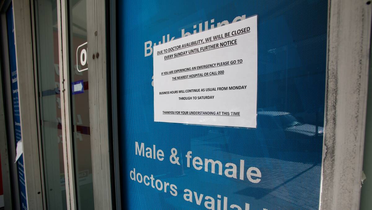 A sign outside an Illawarra GP centre in 2022 covered up the words bulk billing with a notice advising the practice would be closed Sundays. File picture by Anna Warr
