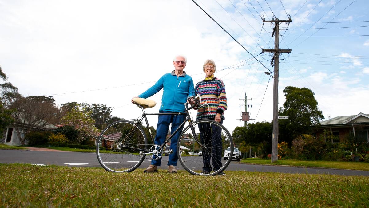 Excitement building: Mount Ousley residents Harry and Wendy Fuller. Harry is holding the old bike his father used to cycle across the state. Photo: Anna Warr