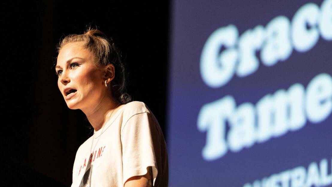 Grace Tame addressing a crowd of staff and students at the University of Wollongong during a 2022 conference. Picture: supplied.