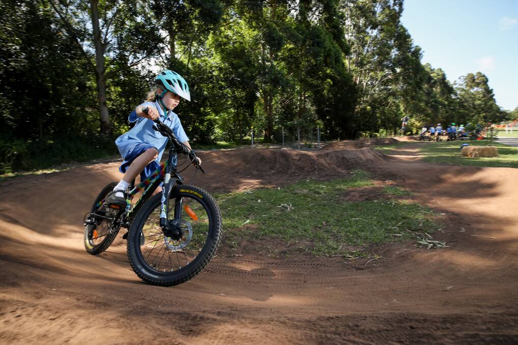 Pumped: Mount Keira six-year-old Olivia Berry riding the new trial pump track the council has installed at Harry Graham Park. Pictures: Adam McLean. 