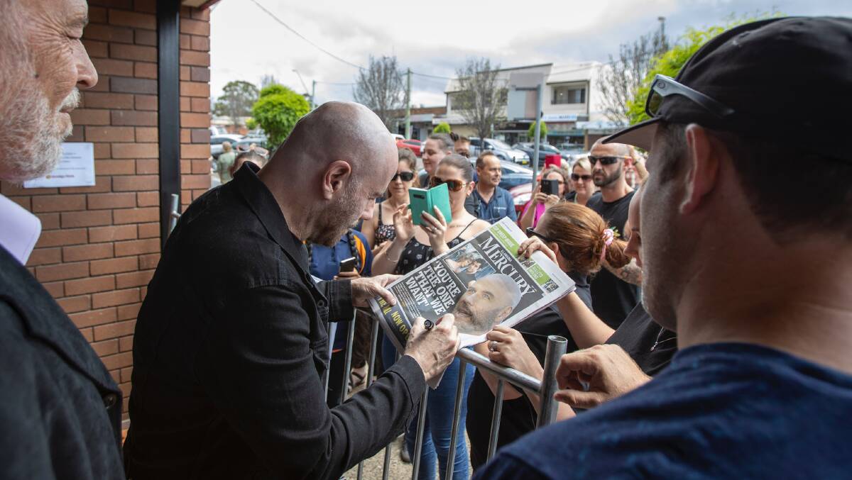 Calm presence: Mr Rees looks on as Mr Travolta greets his fans. Picture: Jasper Burrows-Millican.