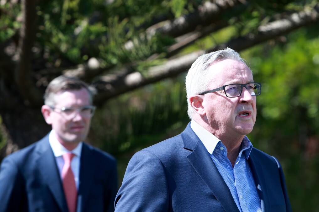 Another year: Announcing the preferred site for the hospital at Dunmore, NSW Health Minister Brad Hazzard said he hoped it would be up and running by 2027. But the completion date is now listed as 2028. Picture: Sylvia Liber.