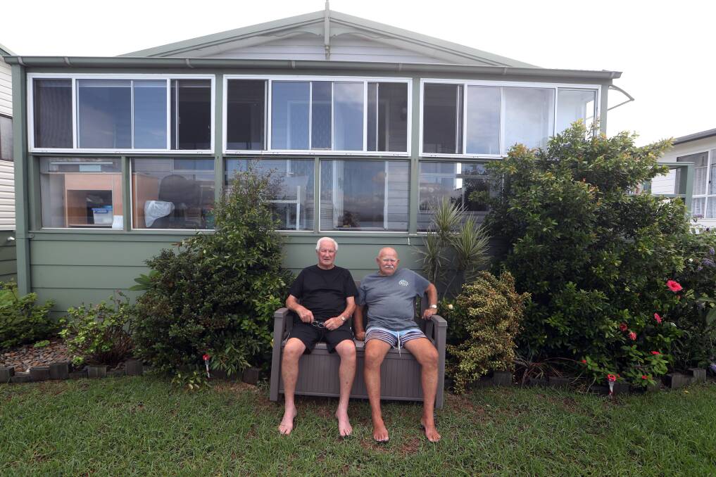 No worries: Ken Carswell and Robert Miller spent the morning watching the tide come in. Pictures: Robert Peet.