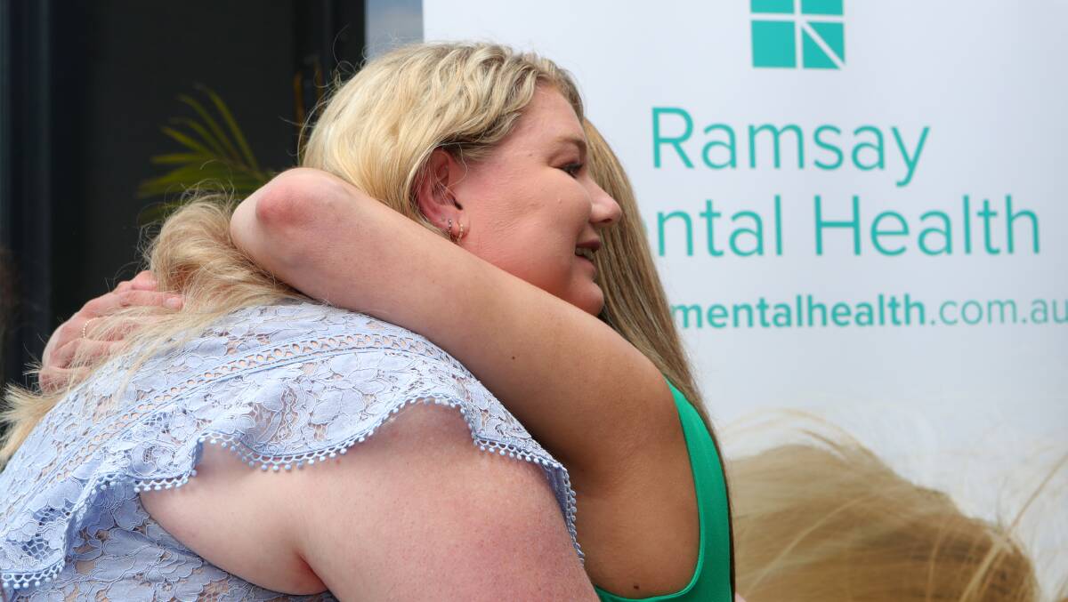Dr Williams and Bianca embrace after her speech at the opening of Ramsay Clinic Thirroul. Picture by Sylvia Liber.