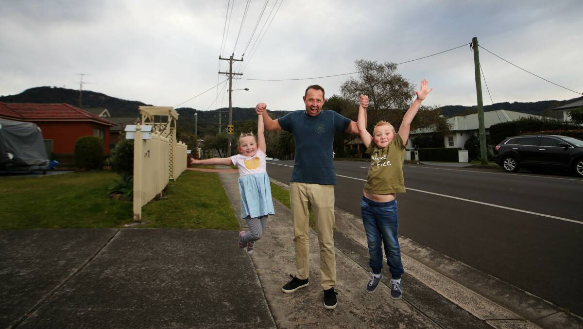 Family affair: Cabbage Tree Lane resident Peter McRae with his kids Emily and James. Picture: Sylvia Liber.