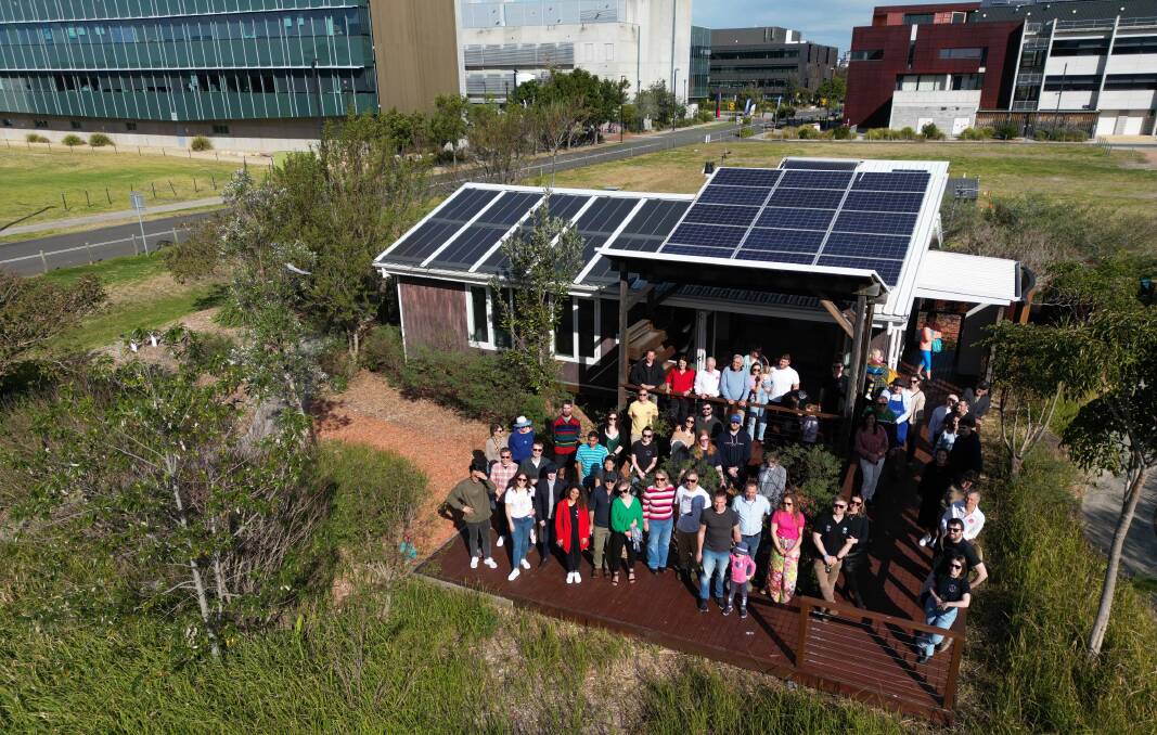 Former and current students and academics who were involved in the 2013 Solar Decathlon gather at UOW's Illawarra Flame House. Picture supplied