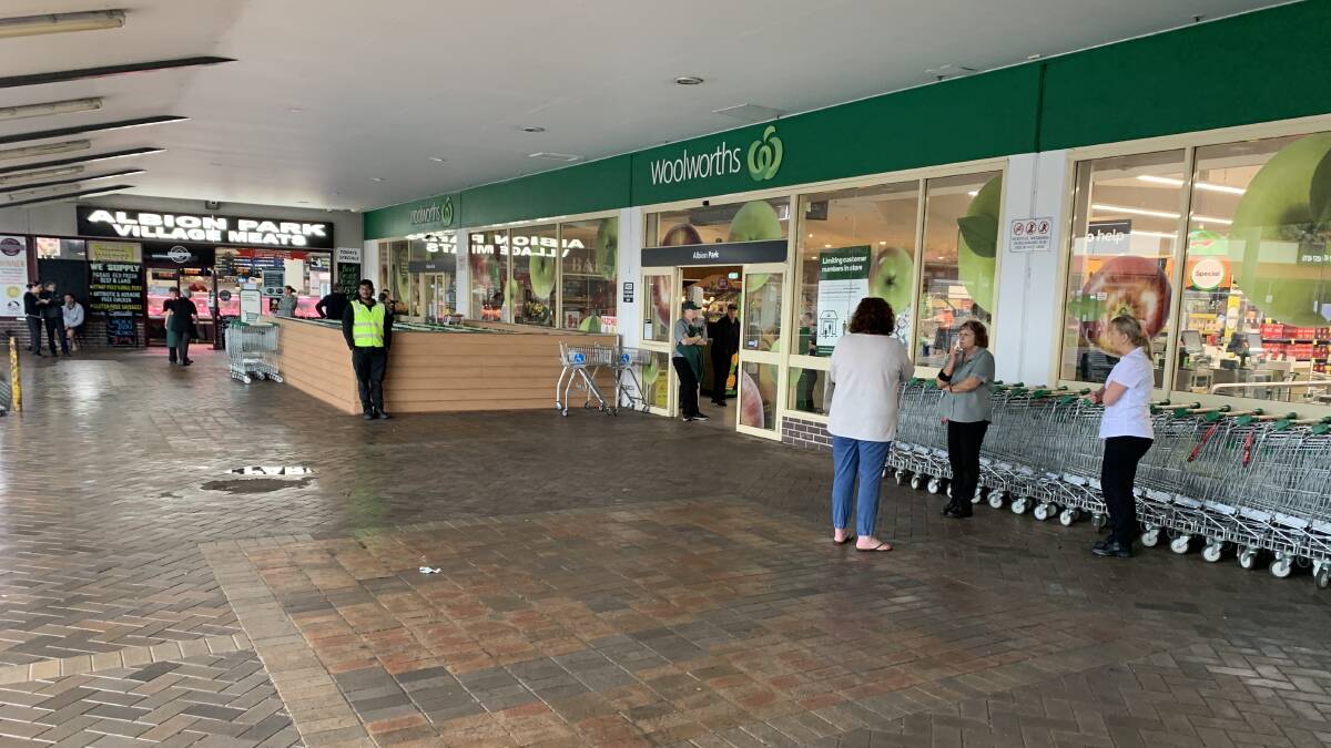 Part of the roof has collapsed at Albion Park Woolworths, and the store is closed due to water coming through. Staff at the store say they are uncertain whether theyll be able to reopen today. Picture: Brendan Crabb.
