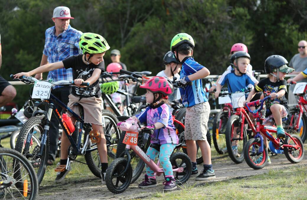 Plans to expand: Young riders use the makeshift mown-grass track that Helensburgh Off Road Cycle Club hopes to build on to create a dedicated track and skills park. Picture: Greg Amadio.