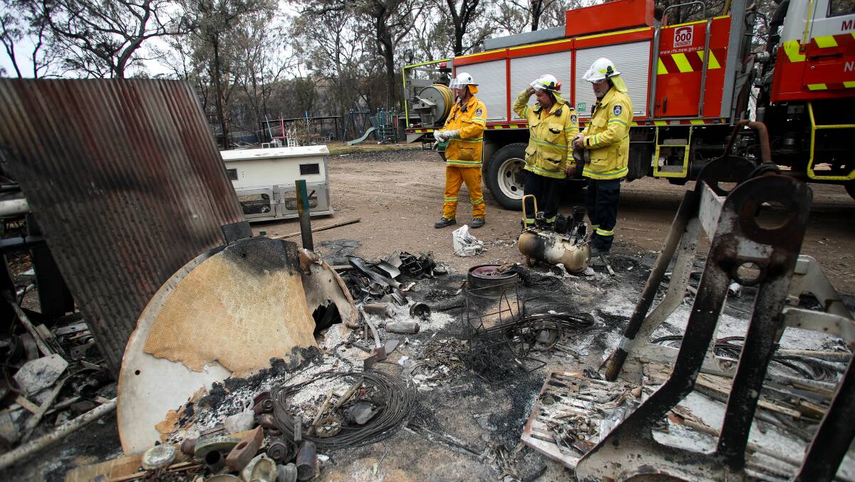RFS members surveying a property in Bargo after fire destroyed the property in mid-December.
