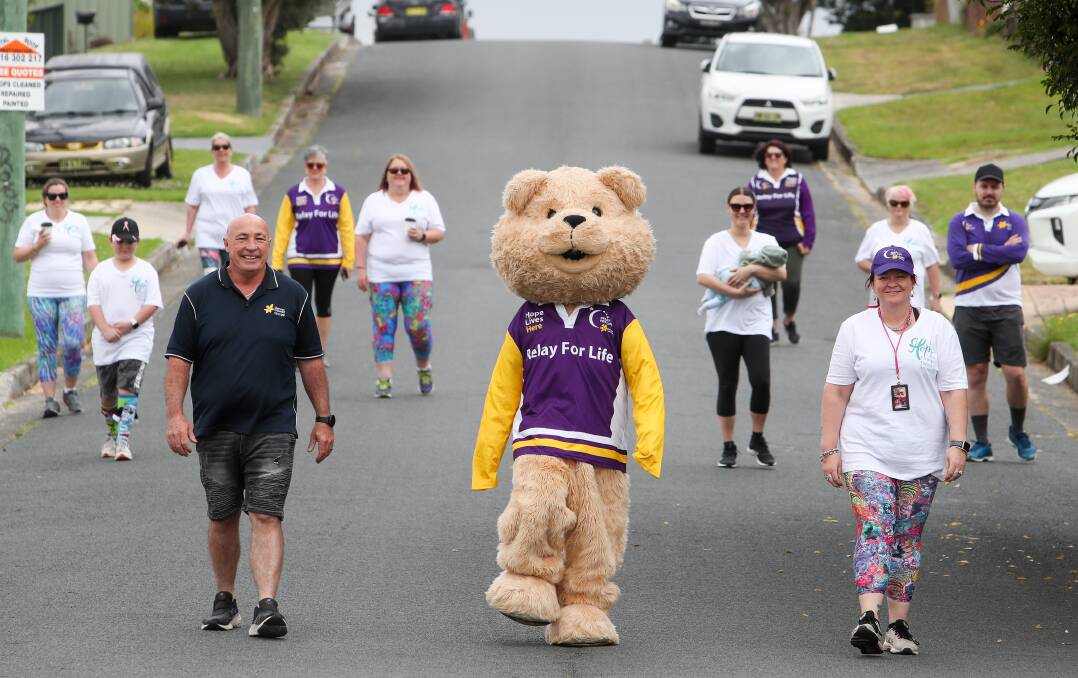 Relay spirit in the suburbs: Organiser of Team AHM, Michelle Ford (right) leads a walk in Billabong Avenues, Dapto. Picture: Adam McLean.