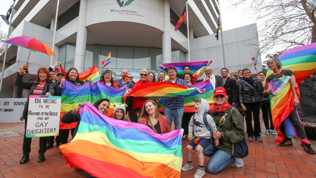Labor candidates held a rally on Monday to call for the council to raise the rainbow flag.