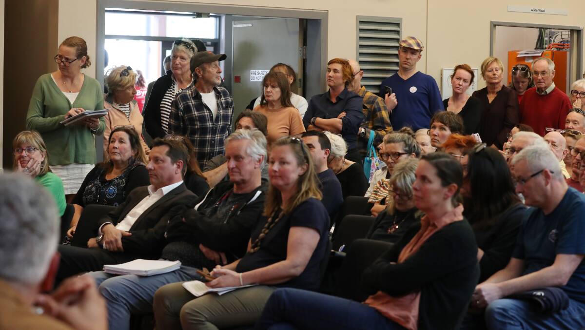 Part of the crowd which packed the Thirroul community centre. Picture by Robert Peet