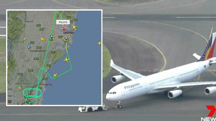The plane lands at Sydney airport. Picture: Seven News Sydney. (Inset: The plane's unusual flight path.) 