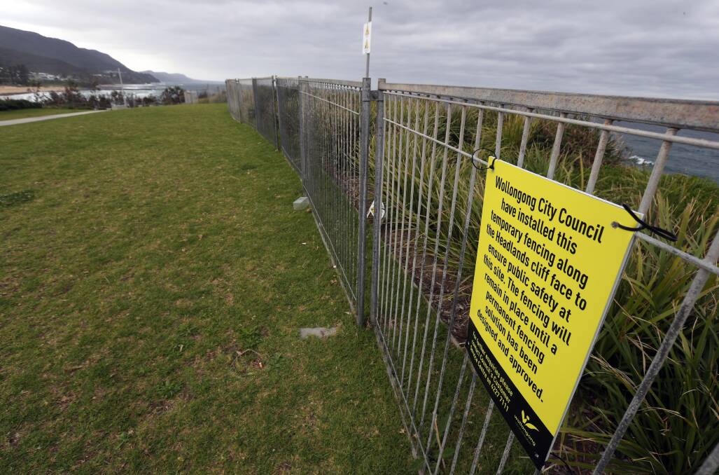 The temporary fence was installed late last year after numerous reports of children playing close to the sheer cliff drop. Picture: Robert Peet.