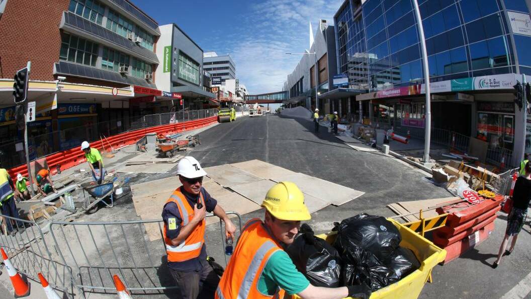 Construction workers on Keira Street next to the West Keira development in 2014.
