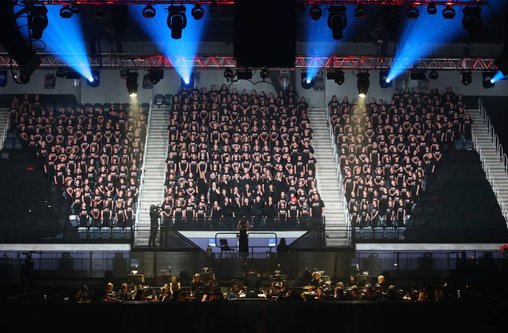Mass of voices: The mass choir features students from schools around the region, with 120 schools taking part in the overall show.