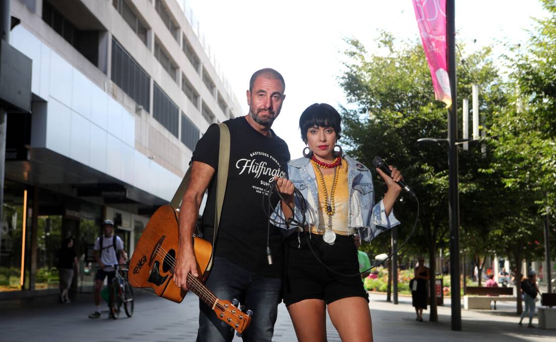 Musicians Eris Bel and Vince Serra want Wollongong council to allow more buskers in the mall, and say their music should be allowed to be amplified. Picture by Sylvia Liber.