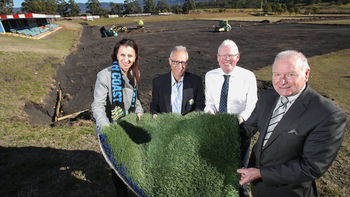 Artificial grass is greener: Football South Coast's Ann-Marie Balliana and Eddy De Gabriele with Kiama MP Gareth Ward and lord mayor Gordon Bradbery as work begins on the synthetic field at Kembla Grange. Picture: Adam McLean.