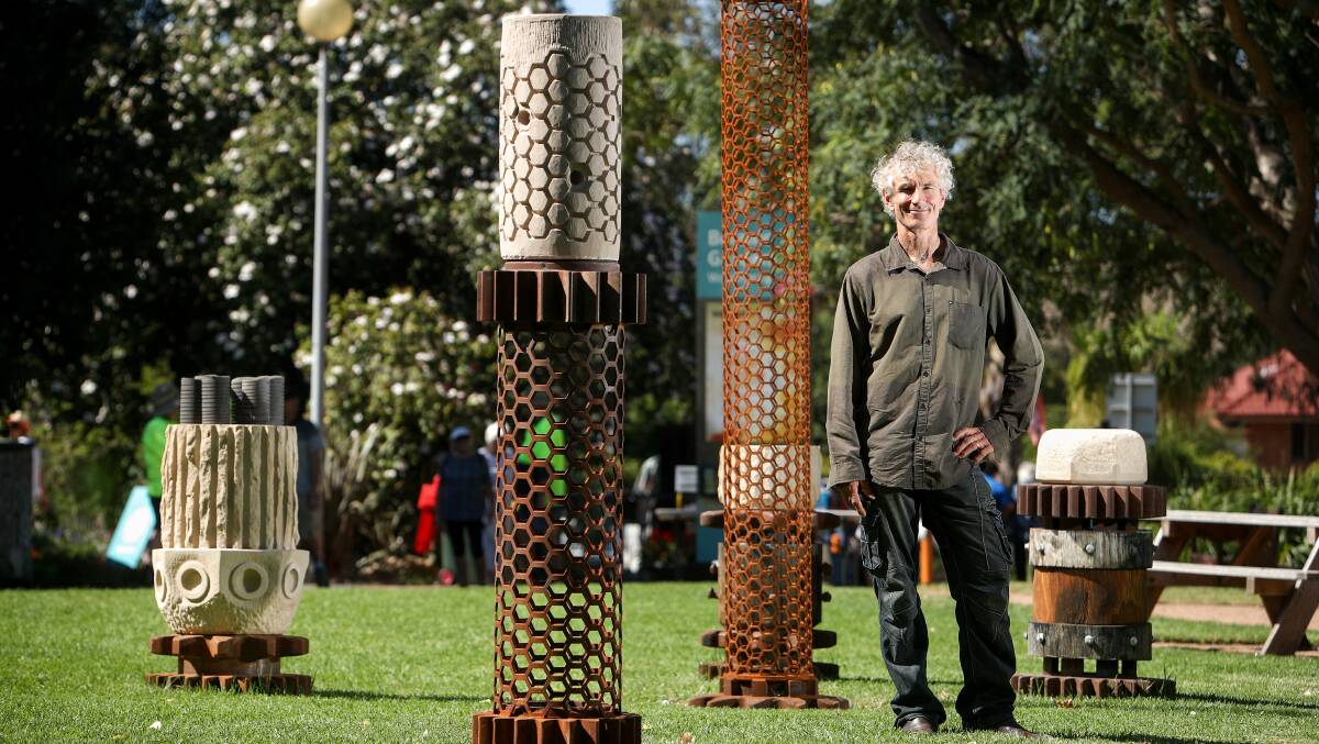 Steel city in the gardens: Berry artist Michael Purdy has been awarded Wollongong council's $30,000 biennial sculpture prize for his steel and sandstone pillars which reference the region's natural surrounds. Picture: Adam McLean.